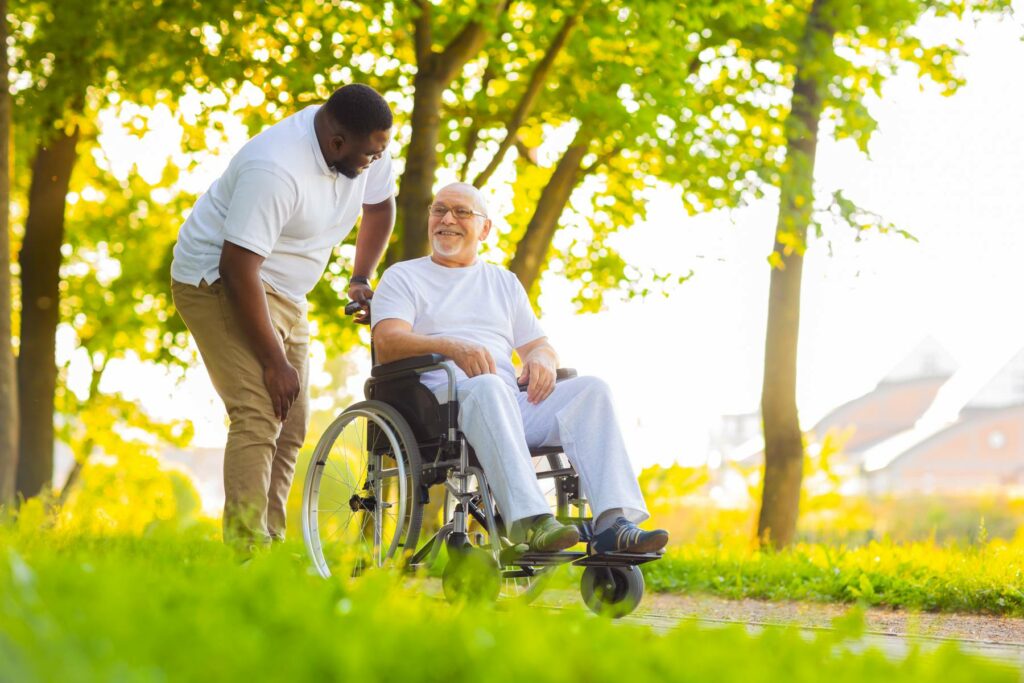 Caregiver and old man in a wheelchair